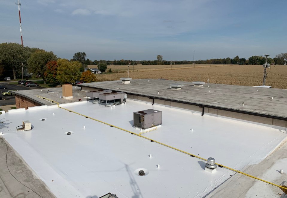 Commercial Roof Being Recoated | Technical Roofing | Roof Coatings